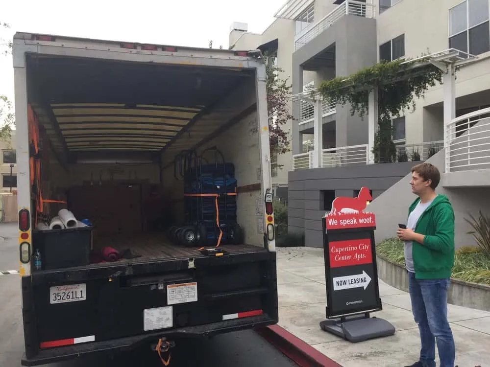 Open box truck at an apartment complex during a move